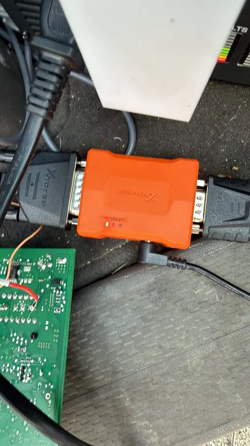 Programming adapter in the car footwell