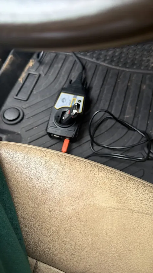 Key programmer on the floor mat