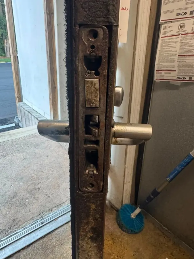 Mortise lock removed from a commercial door